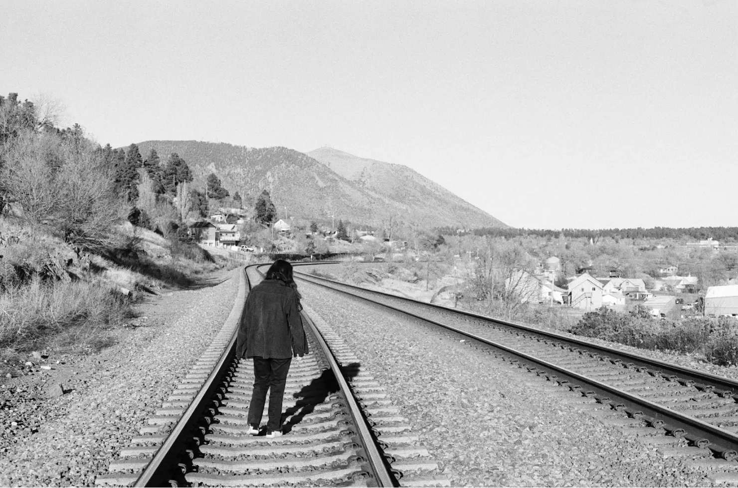 Train tracks and mountain background